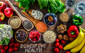 Colorful whole foods including vegetables, fruits, fermented foods, and fiber-rich ingredients that support gut health and clear skin